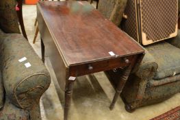 A mahogany Pembroke table.