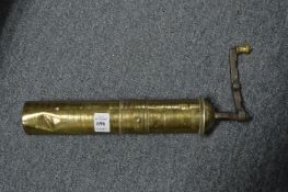 An Arabian brass coffee grinder.