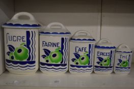 Graduated set of five French porcelain storage jars.