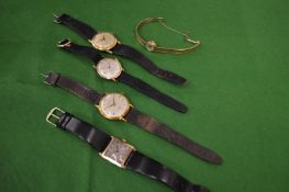 Five various gold cased wrist watches.