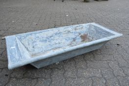 A galvanised rectangular planter/trough.