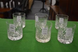 A set of six cut glass whisky tumblers.
