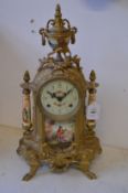 A decorative ormolu mantle clock.