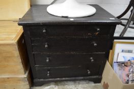 A stained oak four drawer chest.