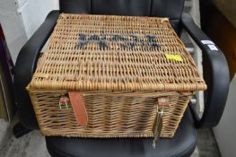 A Fortnum and Mason wicker hamper (lacking contents).