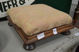 A Victorian rosewood foot stool.
