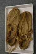 An unusual pair of woven shoes.
