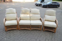 A bamboo three piece conservatory suite comprising two seater settee and pair of matching