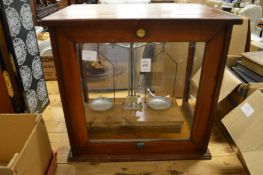 A cased set of scientific weighing scales.