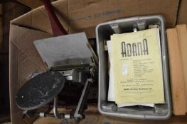 An Adana printer with accessories.