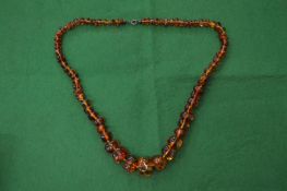 An amber bead necklace.