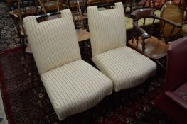 A pair of upholstered side chairs.