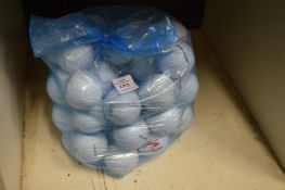 A bag of fifty Dunlop golf balls.