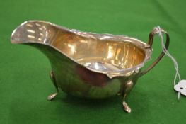 A silver sauce boat.