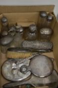 Silver backed dressing table items, cut glass jars with silver mounts etc.