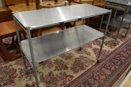 A stainless steel two tier trolley.