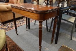 A good William IV mahogany D shaped fold over tea table on turned and reeded legs.