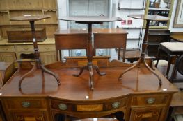 Three mahogany tripod tables.