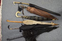 A good collection of ladies parasols.