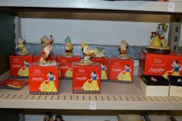 A collection of Disney Showcase porcelain Snow White and Seven Dwarfs, boxed.