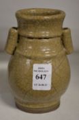 A Chinese small crackle glaze pottery twin handled vase.