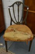 A decoratively painted shield back dining chair.