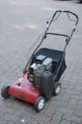 A Mountfield petrol garden lawn scarifier.