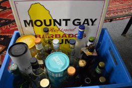 A Mount Gay pressed metal rum sign together with various part bottles of spirits and liqueurs etc (