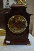An Edwardian inlaid mahogany mantle clock (faults).