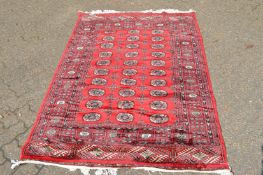 A good large Persian design carpet, pink ground with all-over floral decoration 385cm x 290cm.