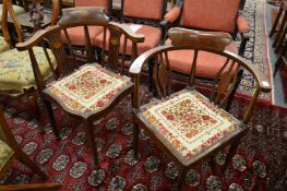 Two Edwardian inlaid mahogany corner armchairs.
