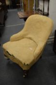 A Victorian upholstered nursing chair.