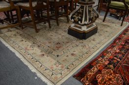 A Persian design carpet, cream ground with stylised floral decoration 250cm x 196cm.