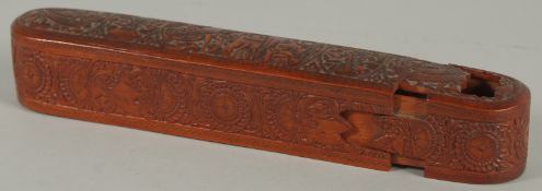 A FINE 19TH CENTURY PERSIAN QAJAR ABADEH CARVED WOODEN QALAMDAN PEN BOX, 21cm long.