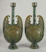A PAIR OF 19TH CENTURY GREEN HISPANO-MORESQUE GLAZED CERAMIC CANDLESTICKS / VASES, 60cm high.