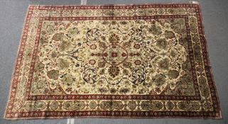 A LARGE PERSIAN KASHAN RUG, 305cm x 199cm.