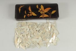 A COLLECTION OF ANTIQUE CHINESE MOTHER OF PEARL GAMING COUNTERS, various types, together inside a