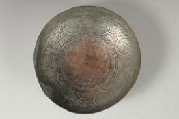 A 18TH CENTURY PERSIAN TINNED COPPER MAGIC BOWL, 18.5cm diameter.