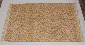 A 19TH CENTURY SAFAVID STYLE TEXTILE, depicting a repeated pattern of a courtier holding a wine