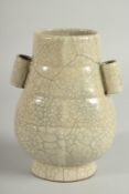 A CHINESE CRACKLE GLAZE TWIN HANDLE VASE, 18.5cm high.