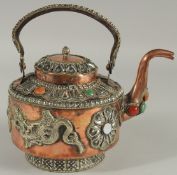 A SRI LANKAN COPPERED METAL EWER, with mounted dragons and stones.