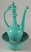 A RARE 17TH-18TH CENTURY PERSAIN SAFAVID MONOCHROME TURQUOISE GLAZED POTTERY LIDDED EWER AND