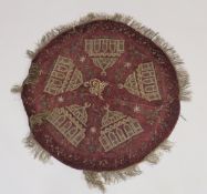 AN OTTOMAN GILT METAL THREADED RED VELVET CIRCULAR TEXTILE, embroidered with mosques, 81cm