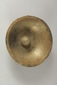 A 19TH-20TH CENTURY PERSIAN QAJAR ENGRAVED BRASS MAGIC BOWL, with panels of calligraphy