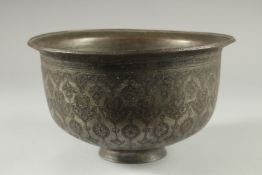 A 16TH-17TH CENTURY SIGNED SAFAVID TINNED COPPER BOWL, engraved with decorative floral motifs, 25.