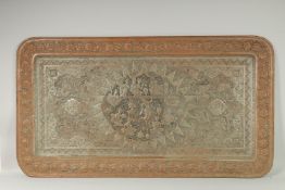 A VERY LARGE PERSIAN ISFAHAN EMBOSSED AND CHASED TINNED COPPER RECTANGULAR TRAY, with a central