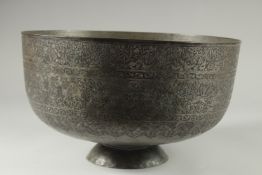 A FINE AND LARGE 19TH CENTURY QAJAR ENGRAVED TINNED COPPER BOWL, with a band of various figures
