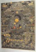 A TIBETAN THANGKA MOUNTED ON PAPER.