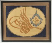 A TURKISH TUGHRA PAINTING ON PAPER, framed and glazed, 44.5cm x 54.5cm.