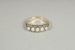 A 9CT GOLD FIVE STONE OPAL RING.